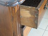 a wooden desk with a drawer on top of it