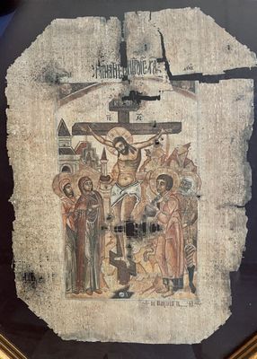 une image représentant un tableau de Jésus sur la croix, dans un cadre