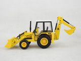 a yellow toy bulldozer that is on a white surface