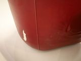 a red bag sitting on top of a white table