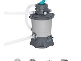 an image of a gray and blue water filterer with a blue handle