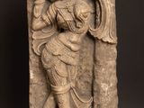 an image of a stone statue of a woman holding a baby