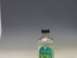 a bottle of alcohol sitting on a shelf in a room