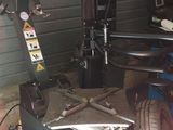 an image of a car being worked on in a garage