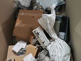 a cardboard box full of electronic equipment in it
