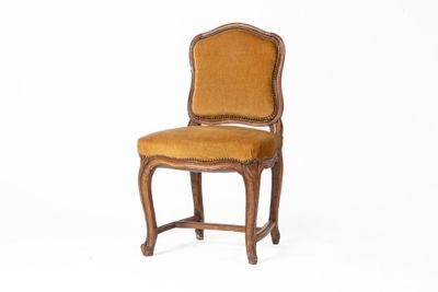 an image of a wooden chair with a yellow upholstered seat