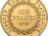 a close up of a gold coin with a wreath on it