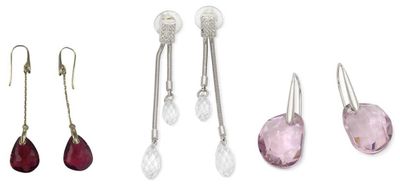 three pairs of earrings and a pair of earrings on a white background