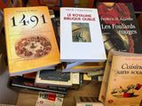 many books that are sitting in a box together