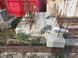 a pile of concrete blocks sitting on the side of a train track