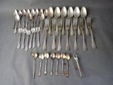 a lot of spoons and spoon spoons on the table