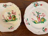 two plates that are sitting on a wooden table