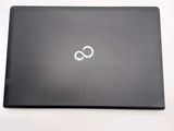 a black laptop with an infinite symbol on the screen