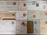 many different types of letters and envelopes laid out on a table