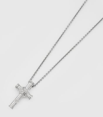 a close up of a cross on a chain with a cross on it