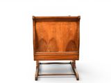 an image of a small wooden chair on a white background