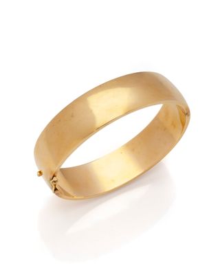 a close up of a gold ring on a white background