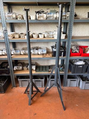 many shelves of pottery on the shelves in the room