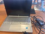 a laptop computer that is sitting on a table
