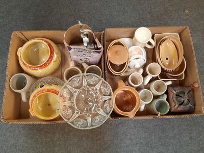 a box full of cups and saucers sitting on the floor