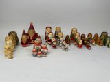 many wooden figurines of different sizes and colors
