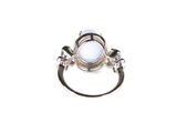 a close up of a ring on a white surface with a white background