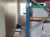 a room with a lot of boxes and boxes on the shelves