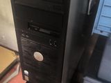 a black computer tower sitting on top of a wooden pallet