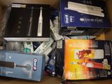 boxes of toothbrushes, toothpaste, toothpaste, and toothpaste in a cardboard box