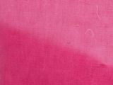 the pink fabric is very soft and has a small hole in it