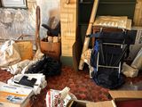 a room filled with boxes and other items on the floor