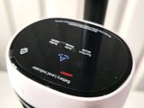 a close up of a black and white device on a table