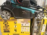 a lawn mower that is sitting on top of a pile of boxes