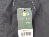 the back of a pair of black pants with a price tag on it