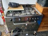 a stove that has a bag on top of it
