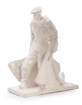 figurine of a man sitting on a bench with an umbrella