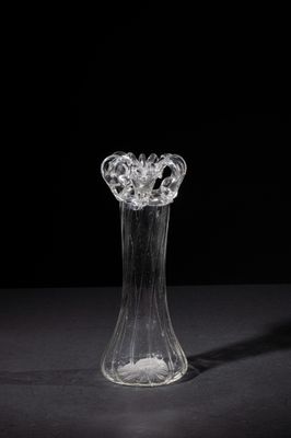 a glass vase that is sitting on a table