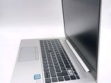 a laptop computer that is sitting on a white surface