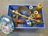 a blue box filled with antique items on the floor