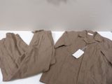 a brown suit and pants sitting on a white table
