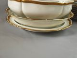 two plates and a bowl are stacked on top of each other