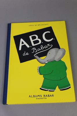 an image of a book with a picture of an elephant holding a sign