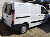 a white van that is parked in a parking lot