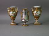 three vases that are sitting on a table