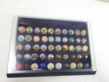 a box of buttons that are on a table