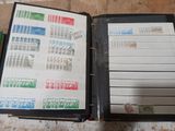 a black binder with stamps on it sitting on a table