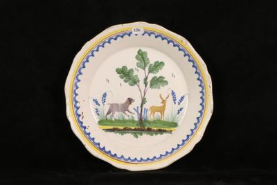 a plate with a picture of a deer and a dog on it