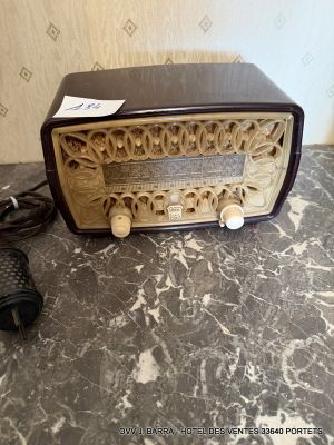 an old fashioned radio sitting on a marble table