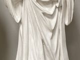 a statue of a woman holding a baby in her arms