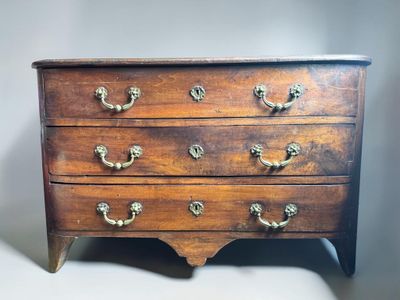 an old wooden chest of drawers with brass handles and knobs